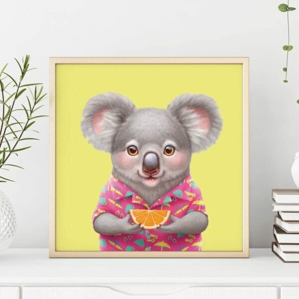 A koala art print in a frame. The koala is holding an orange.