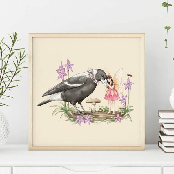 A framed art print of an Australian fairy hugging her magpie friend