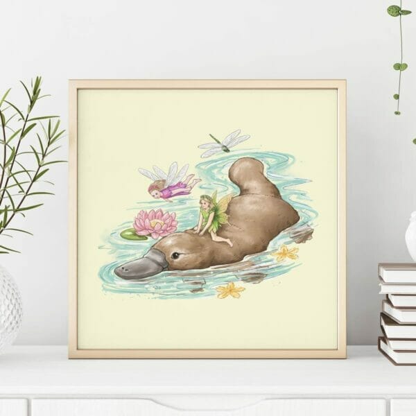 Framed art print of two fairies riding a platypus